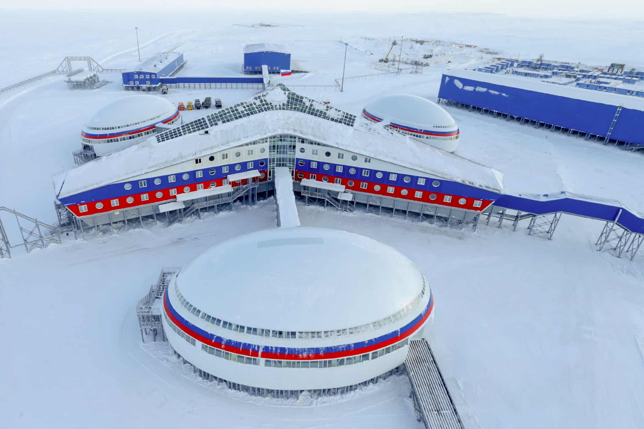 ed white and blue buildings in a snowy white plain