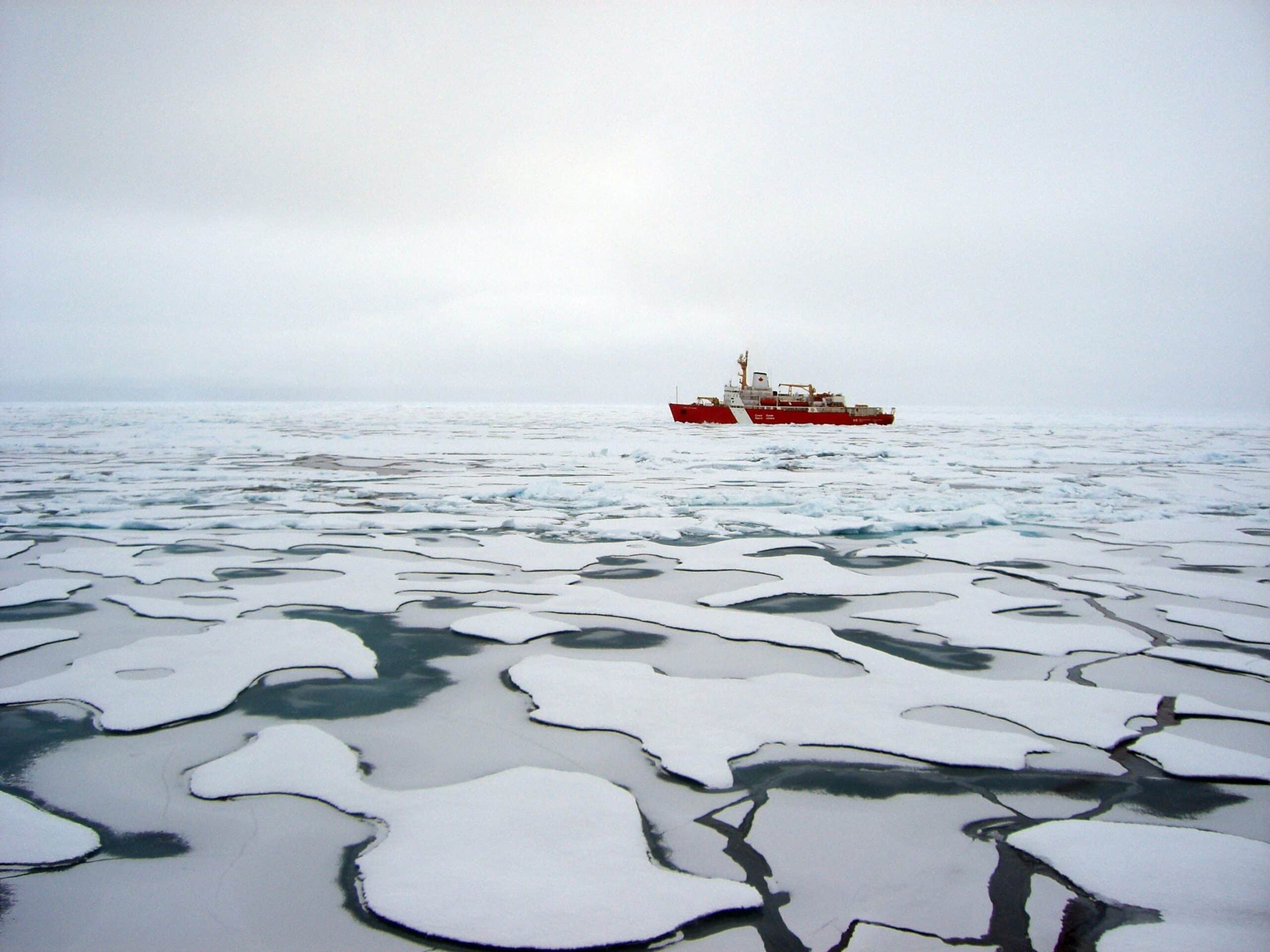 Canadian Coast Guard vessel breaking through Arctic ice