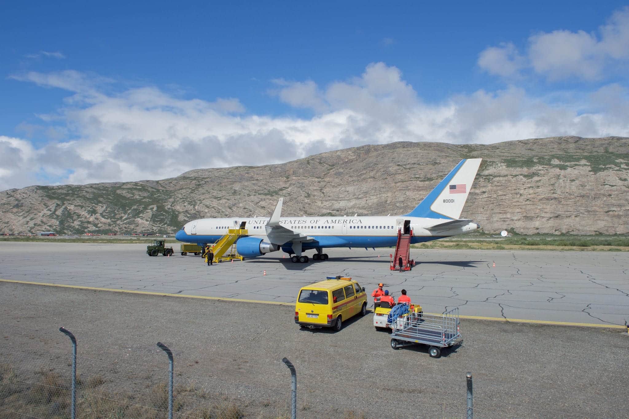 U.S aircraft on runway in Kangerlussuaq, Greenland with mountain in the back